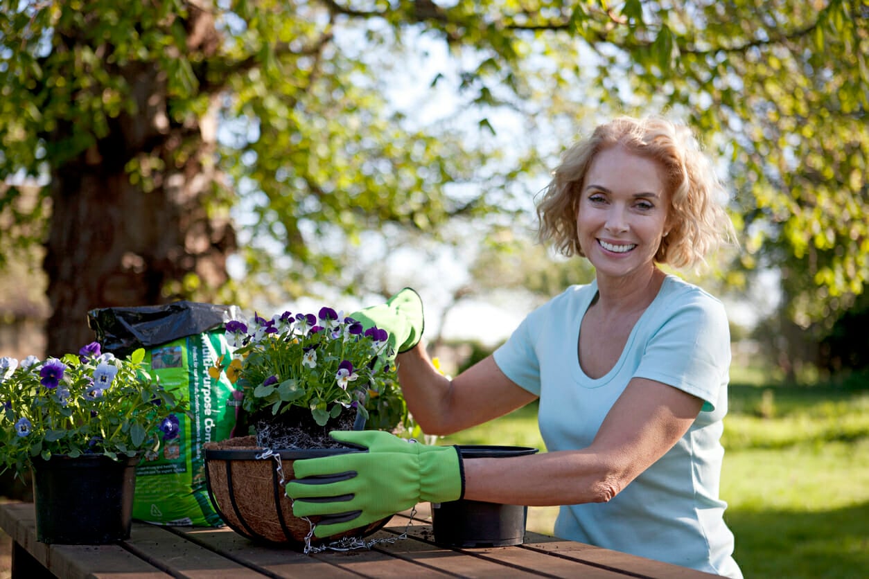 woman happily gardening