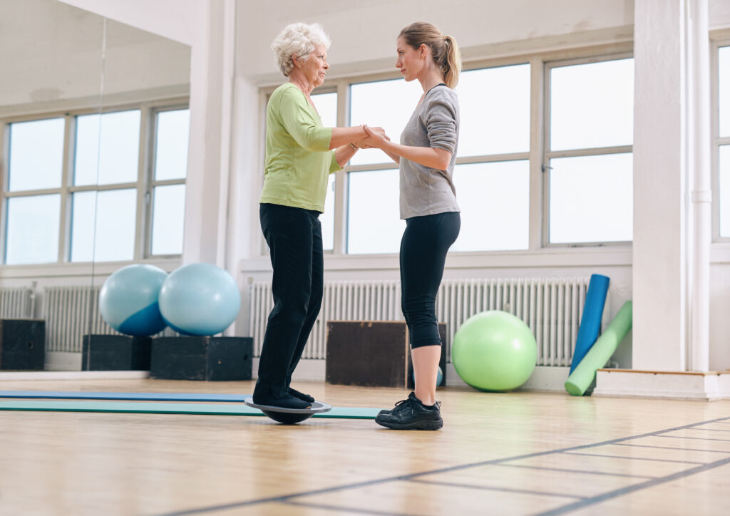 Physical Therapist doing balancing training with patient