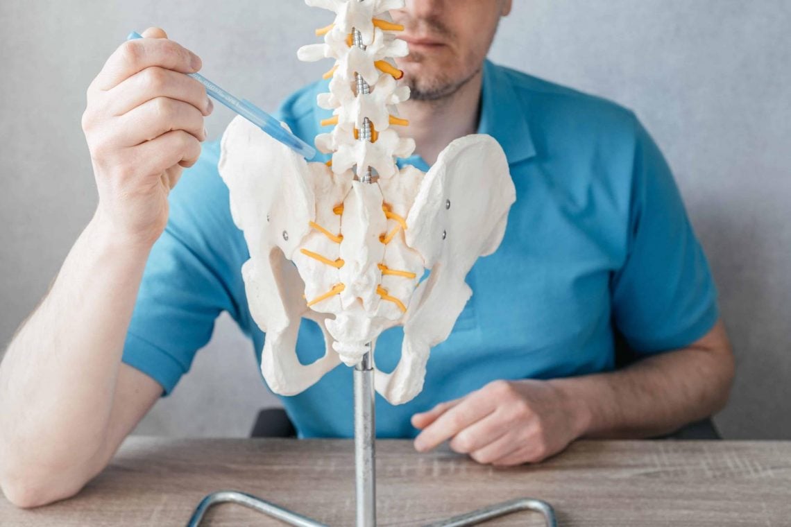 male-doctor-s-hand-pointing-at-the-sacroiliac-join-2024-09-17-03-00-47-utc-2-2