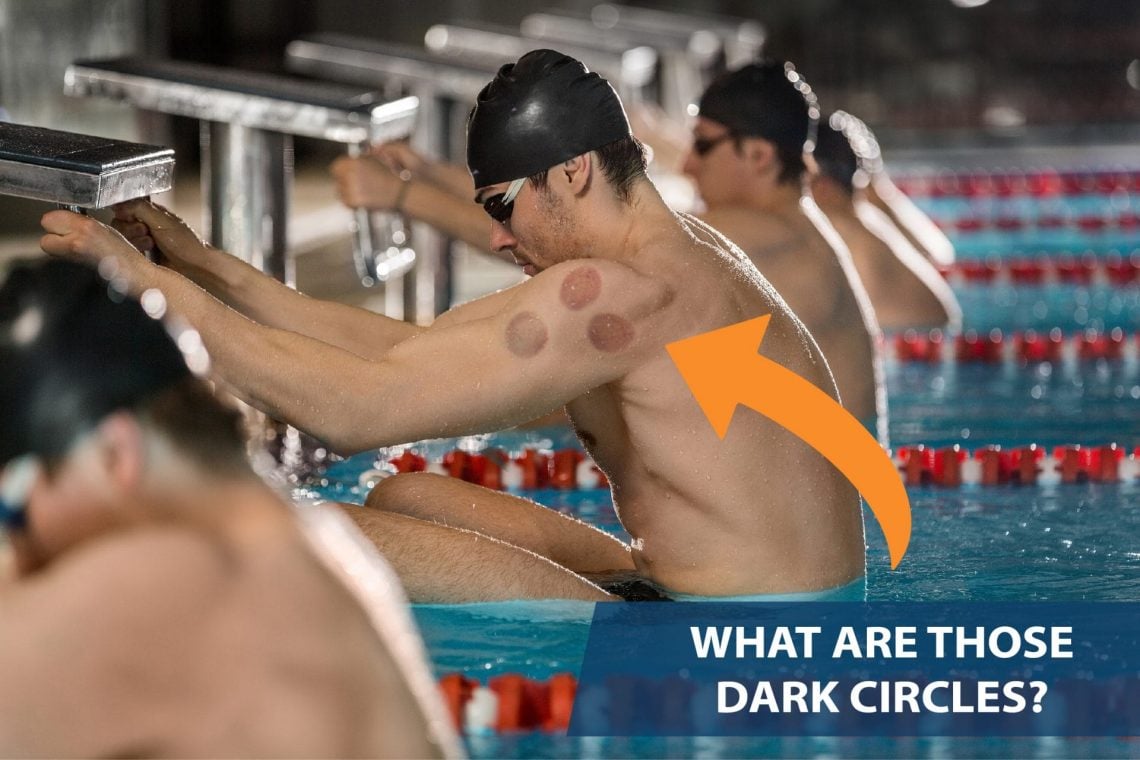 male-swimmers-holding-their-starting-blocks-2023-11-27-05-14-57-utc